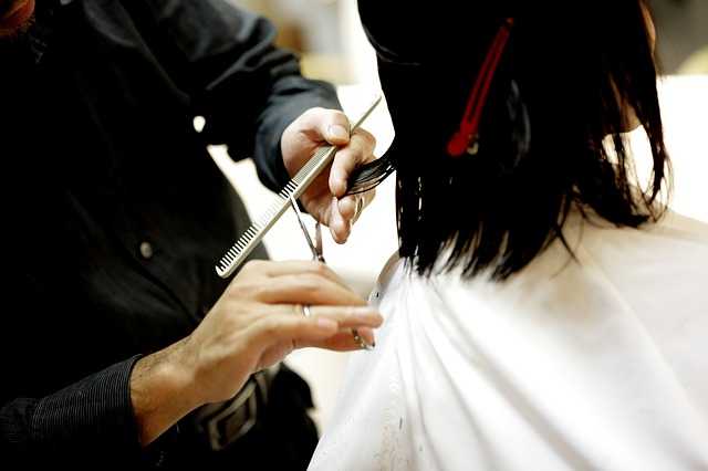 hair dresser cutting hair
