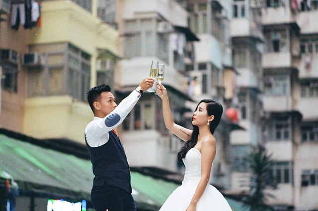 Wedding couple holding wine glass