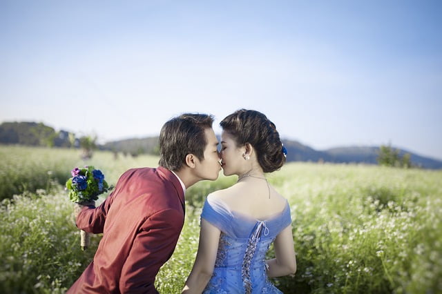 Bride and groom kissing each other